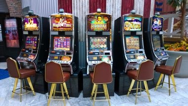 Live roulette wheel with ball landing on red
